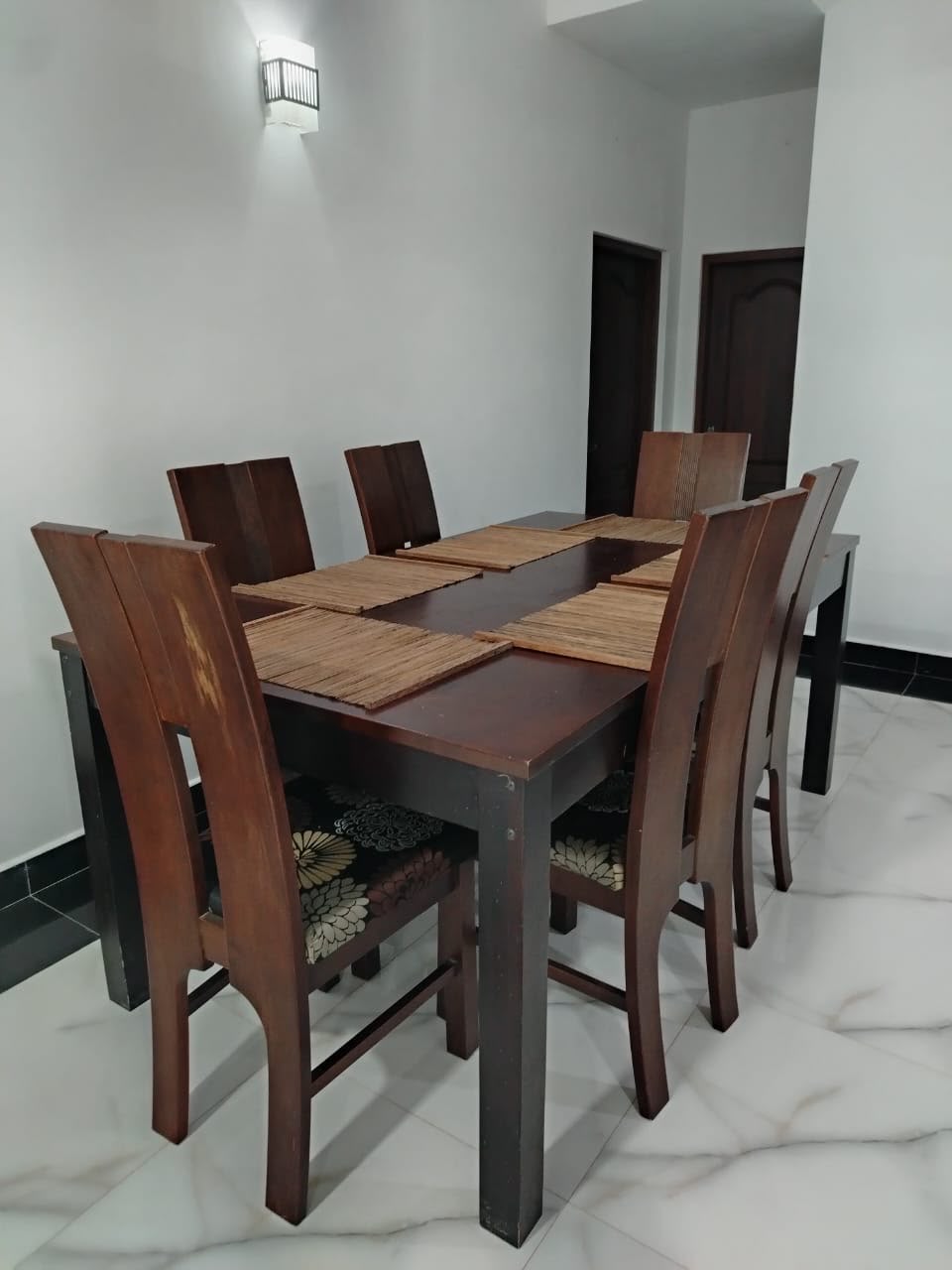 Dining table with six wooden chairs