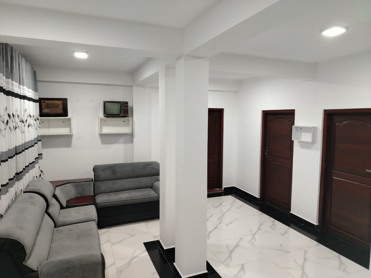 Spacious living room and hallway doors